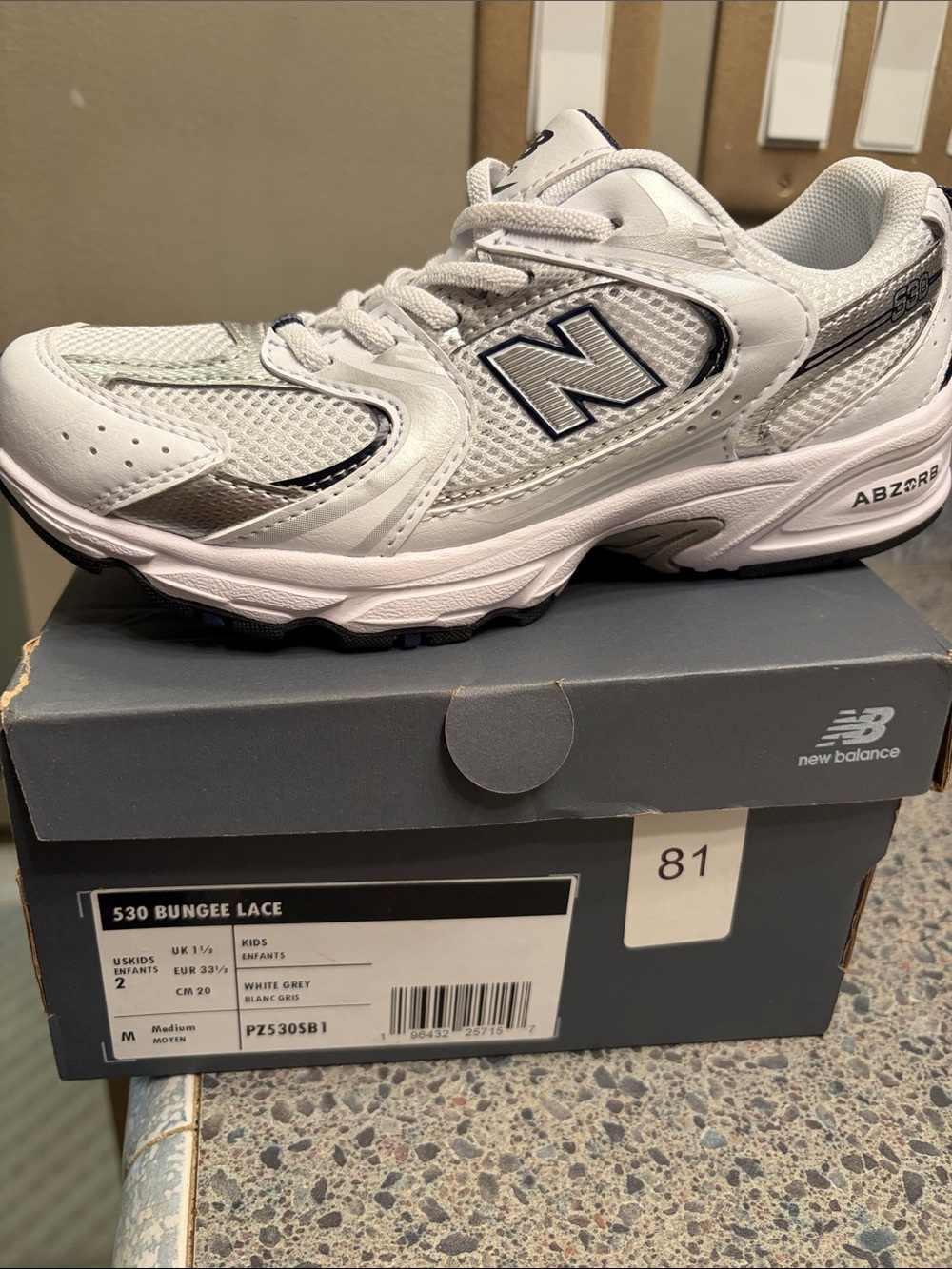 New Balance Kids 530 Sneaker in White and Grey